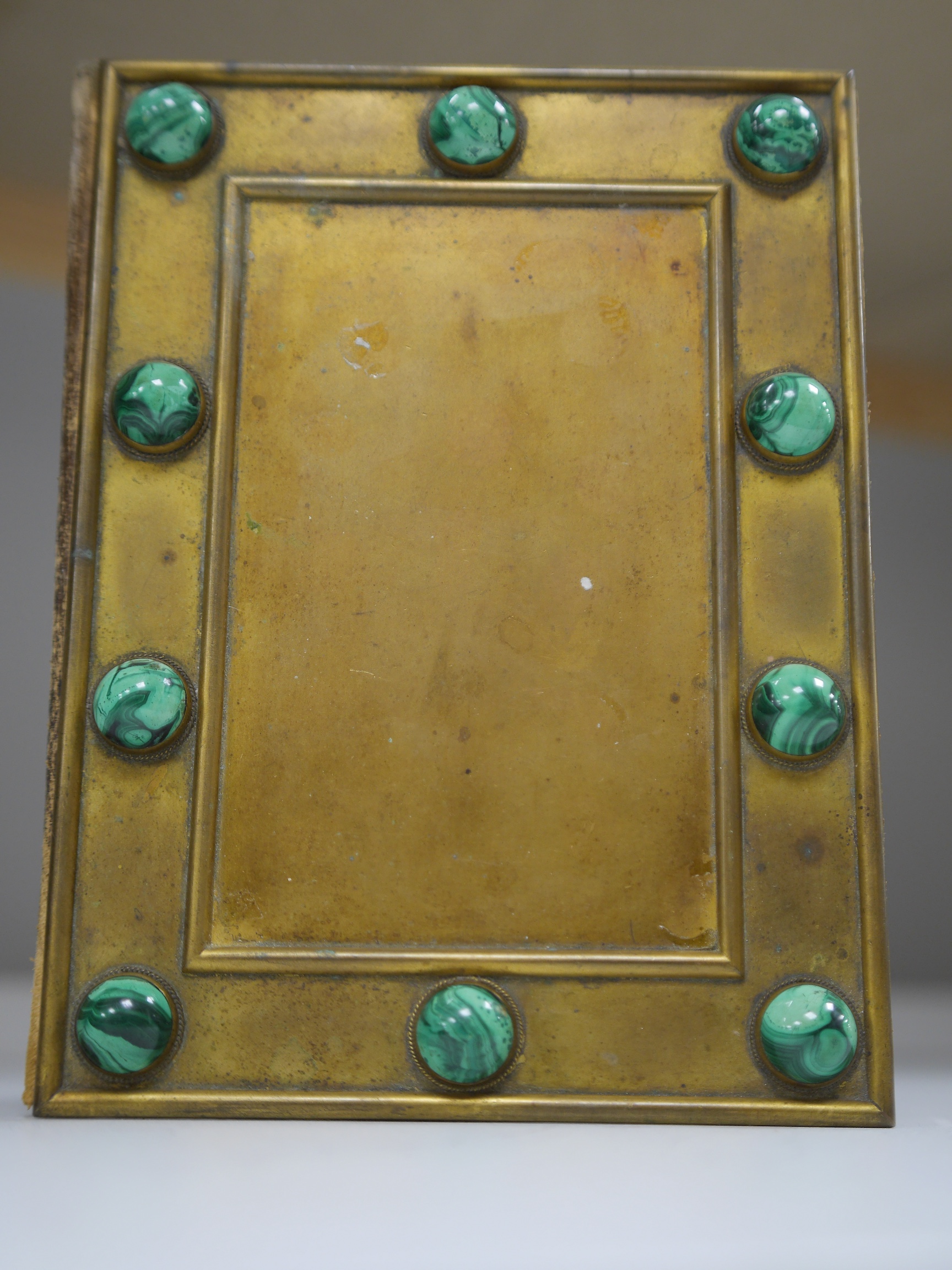 A 19th century malachite inset gilt brass blotter, 19cm wide x 26.5cm high. Condition - leather scuffed, brass tarnished